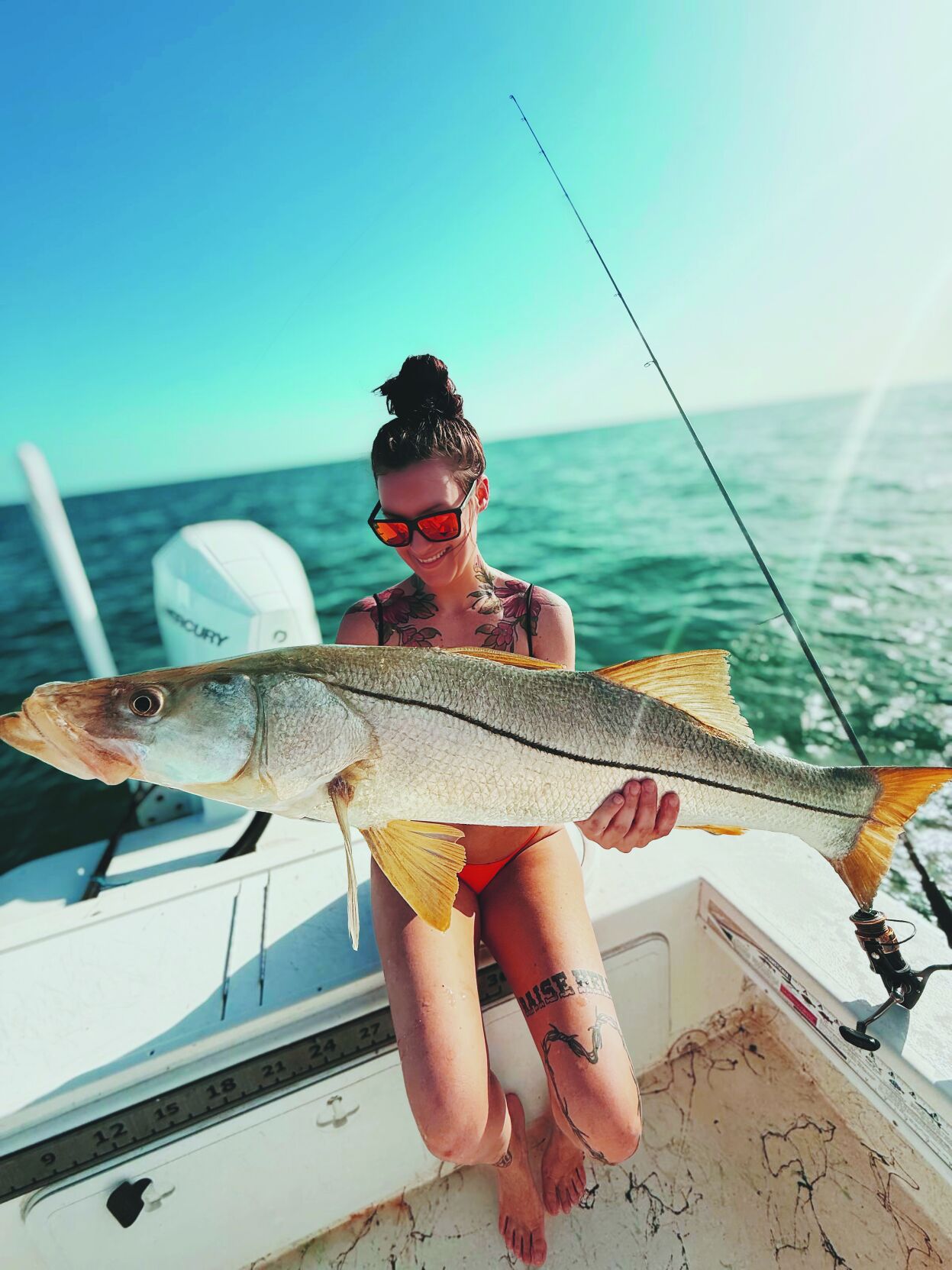 Lady angler with snook