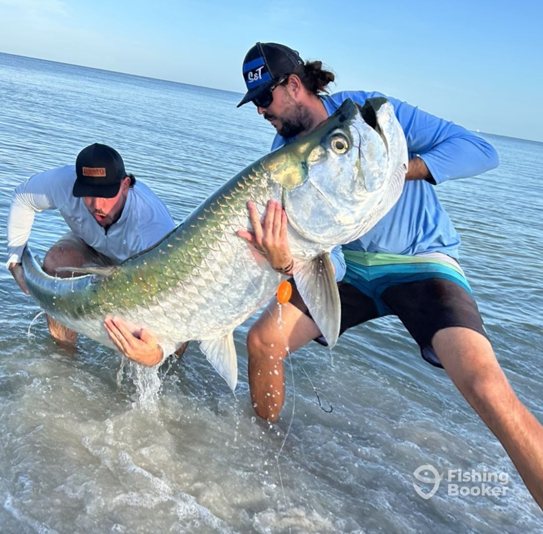 Captain Garrett with clients and their catch